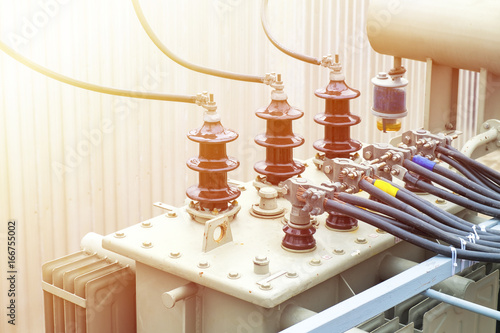 High voltage electric transformer in a power substation above the construction site. Flare filter added.