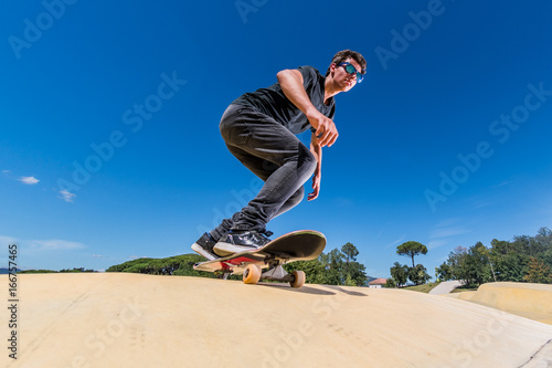 Skateboarder on a pump track park