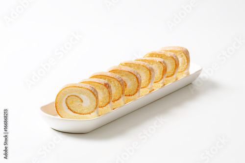 Slices of cream Swiss roll