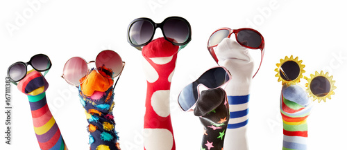 Sock puppets with glasses against white background