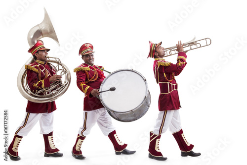 Bandwalas with instruments marching