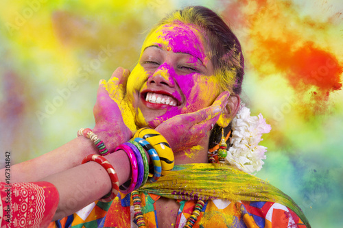 Portrait of young Indian Woman celebrating Holi color festival
