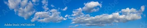 Blue sunny sky with white clouds landscape banner, huge panorama