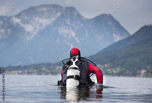 Diver walking in shallow water