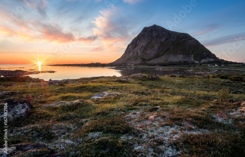 Scenic view with sunset and mountain at summer night in Lofoten, Norway.