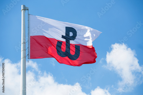 Polish flag with the symbol of Polish Fighting. Symbol of the Warsaw Uprising in 1944