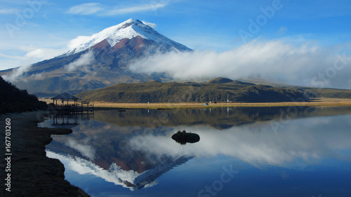 View of the Limpiopungo lagoon with the Cotopaxi volcano reflected in the water on a cloudy morning - Ecuador