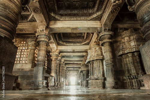 Columns and empty corridor inside the 12th century stone temple Hoysaleswara, now Karnataka state of India