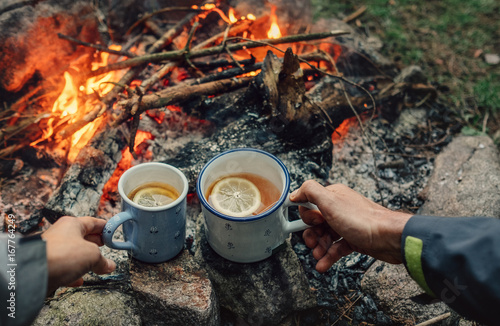 Tea party near campfire