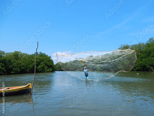 Fisherman with round net