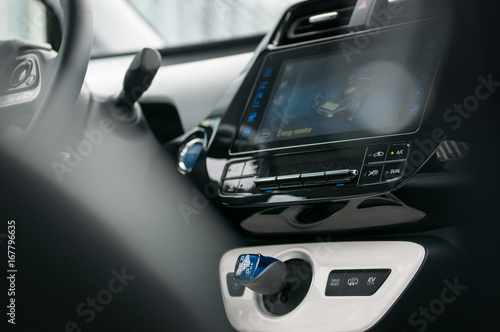 Hybrid car interior and energy monitor display.