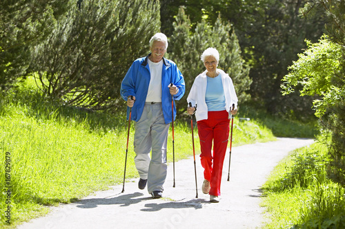 Senior couple doing Nordic walking