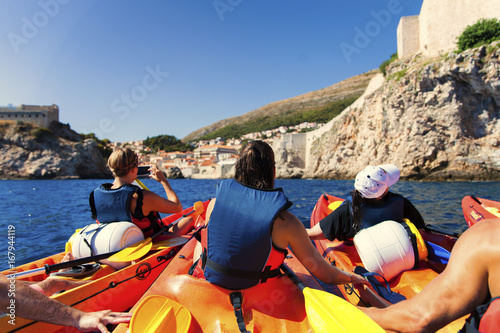 Kayaking between rocks on the adriatic sea in Dubrovnik 