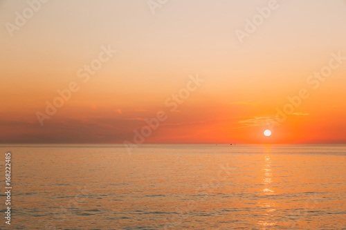 Sun Is Rising On Horizon At Sunset Or Sunrise Over Evening Sea Or Morning Ocean