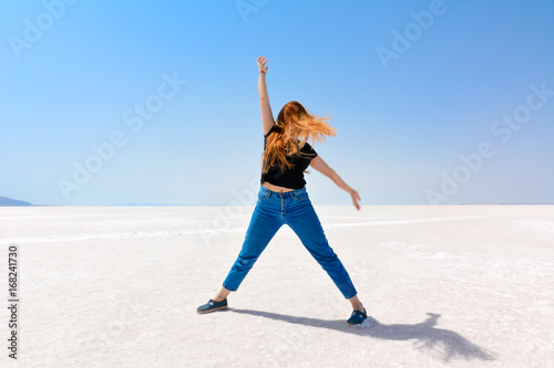 On the salt lake, the happy young girl.