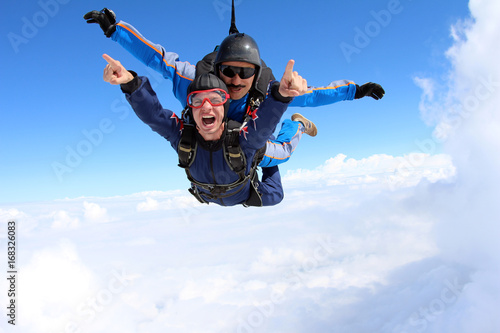 Skydiving. Tandem jump. Happy Passenger.