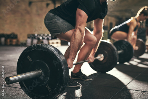 Strong man doing deadlift training in gym