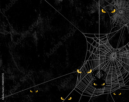 Spider web silhouette against black shabby wall and evil yellow eyes - halloween theme spooky background with place for your text