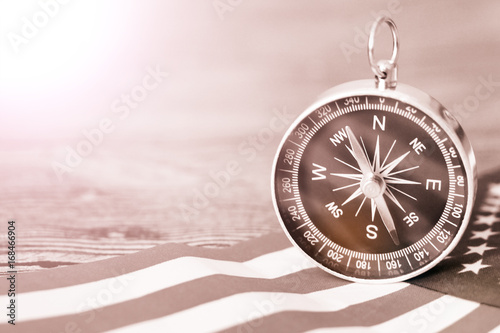 The compass on the American flag and a map of the area