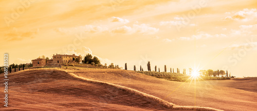 Beautiful typical panorama landscape of Tuscany at sunset, Italy