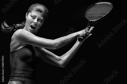 Ready to hit / A portrait of a tennis player with a racket.