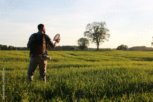 Man in casual clothes is a traveler in the open spaces