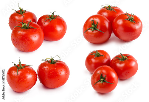 A lot of ripe, organic healthful tomatoes. Many juicy, fresh and bright red tomatoes isolated on a white background. A group of a whole, organic and fresh tomatoes with leaves, top view.