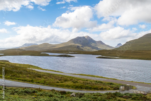 View of Lochan an Ais and Cul Beag from hiking trail at Knockan Crag in North West Highlands Geopark, Scotland