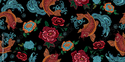 Embroidery oriental seamless pattern with golden carps and flowers. Vector embroidered floral design with fish for fabric.