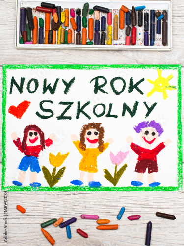 Photo of colorful drawing: Polish words NEW SCHOOL YEAR and happy children. First day at school.