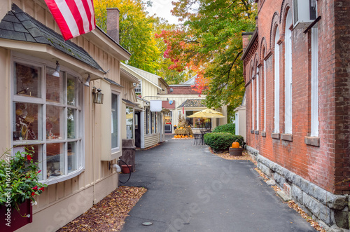 Deserted Alley Lined with Traditional Shops Decorated for Halloween