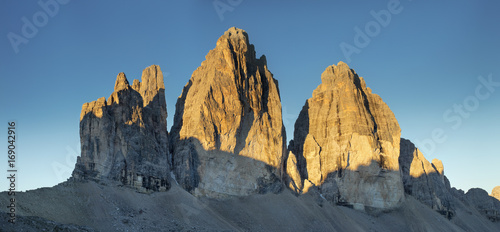 three peaks in sun lights in Italy
