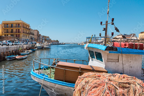 Mazara del Vallo (Italy) - Day view of canal, fishing boats and downtown