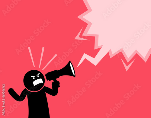 Man screaming out loud with a megaphone. He is declaring and announcing something important. He is full of spirit, emotion, and clenching his fist while shouting with the loudspeaker.