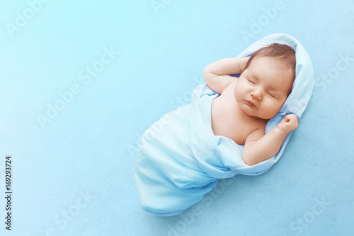 Newborn baby boy sleep on blue blanket