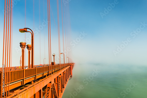 Fog over San Francisco. Part of the famous Golden Gate Bridge. The ocean coast near San Francisco, California.