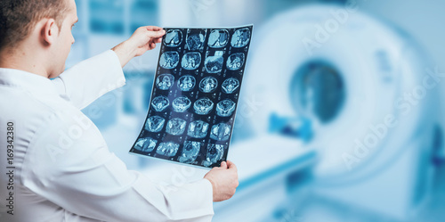 Doctor looking MRI picture.