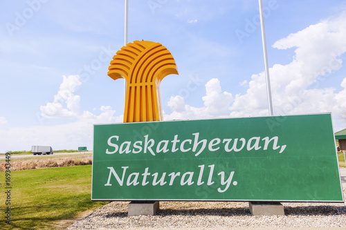 Welcome to Saskatchewan - sign and flags