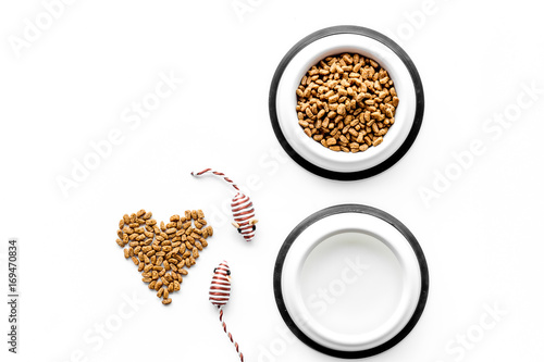 large bowl of pet - cat food with heart print on white background top view mockup