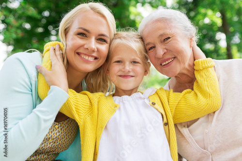 woman with daughter and senior mother at park