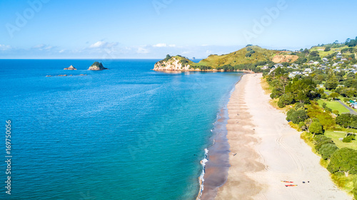 Aerial view on beautiful harbour with sunny beach and surrounding hillside, Coromandel, New Zealand