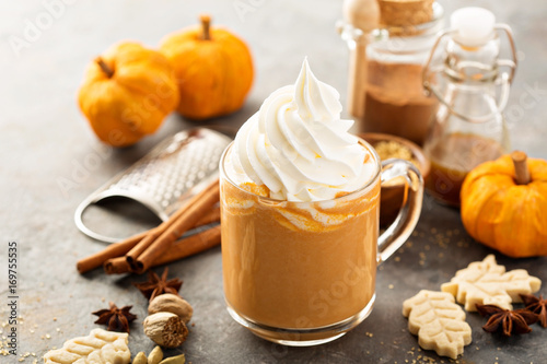 Pumpkin spice latte in a glass mug