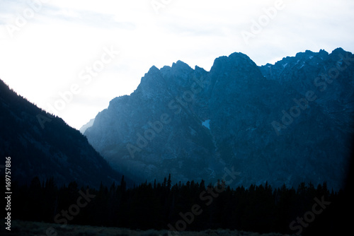 Grand Teton National Park Mountain peaks with snow at sunset 