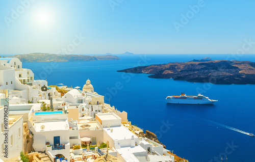 Beautiful panoramic view from touristic Fira town to caldera and volcano at summer sunny day. Santorini(Thira) island.