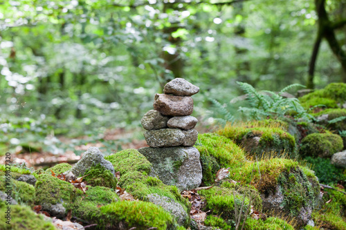 A stack of balanced stones in the forest, Limousin, France