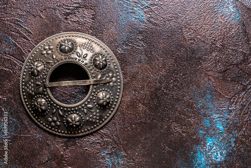 Antique rustic grater on grey background