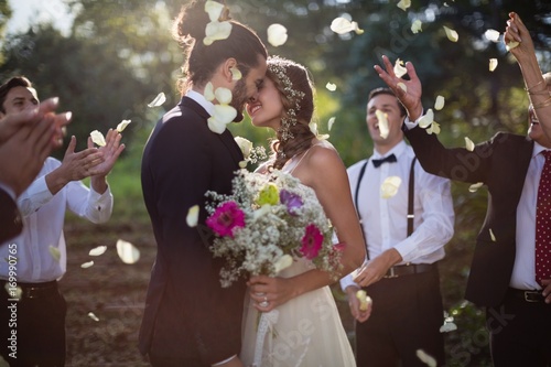 Affectionate bride and groom kissing on their wedding day