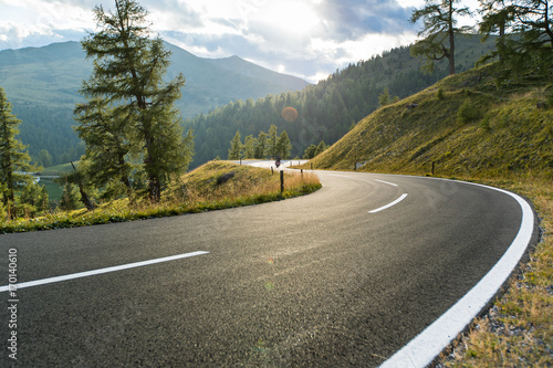 Asphalt road in Austria, Alps in a summer day.