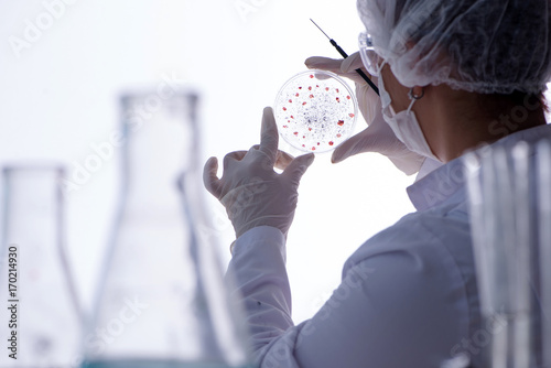 Female scientist researcher conducting an experiment in a labora