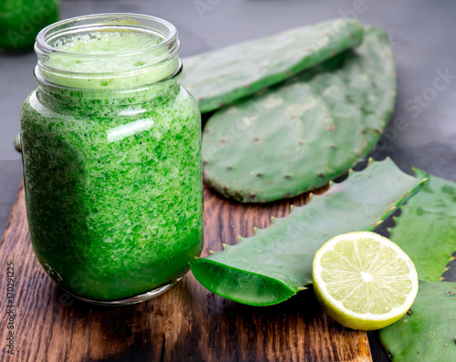 Cactus smoothie. Healthy nopales, aloe vera and lemon detox drink in jars and ingredients